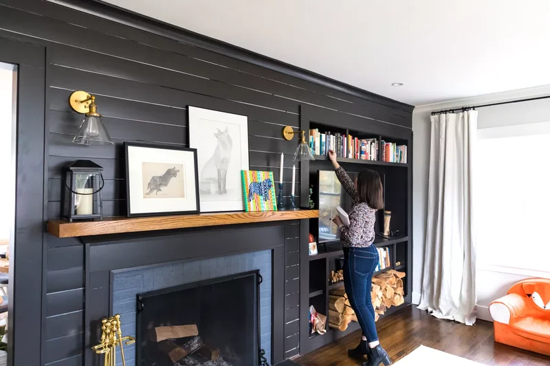 32 Living Room Mantle Decor Ideas That Add Style and Warmth 21 A Black Backdrop