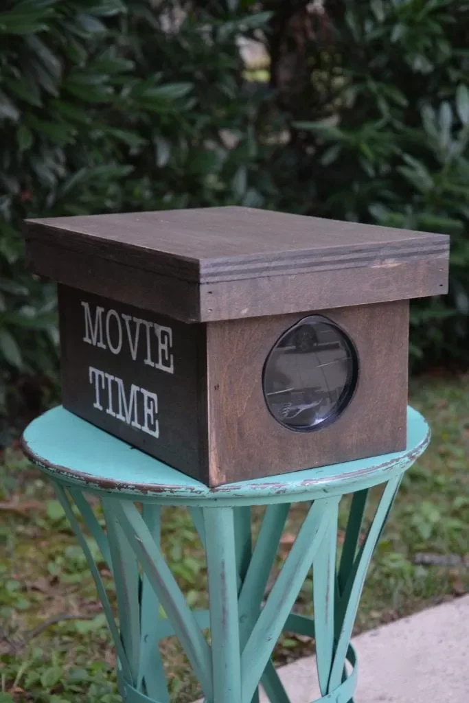 14 Charming Ideas for Creating the Perfect Backyard Movie Experience 4 A DIY Movie Projector for Your Smartphone