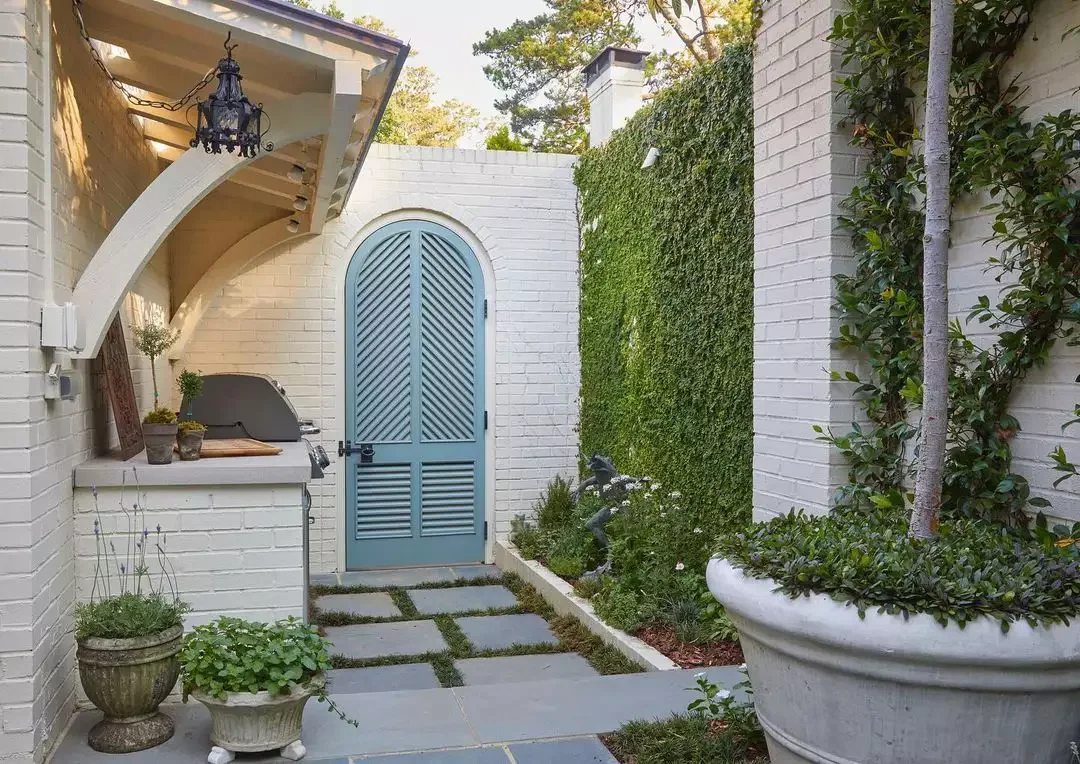 25 Creative Side Yard Transformations to Maximize Your Outdoor Space A Door as a Gate