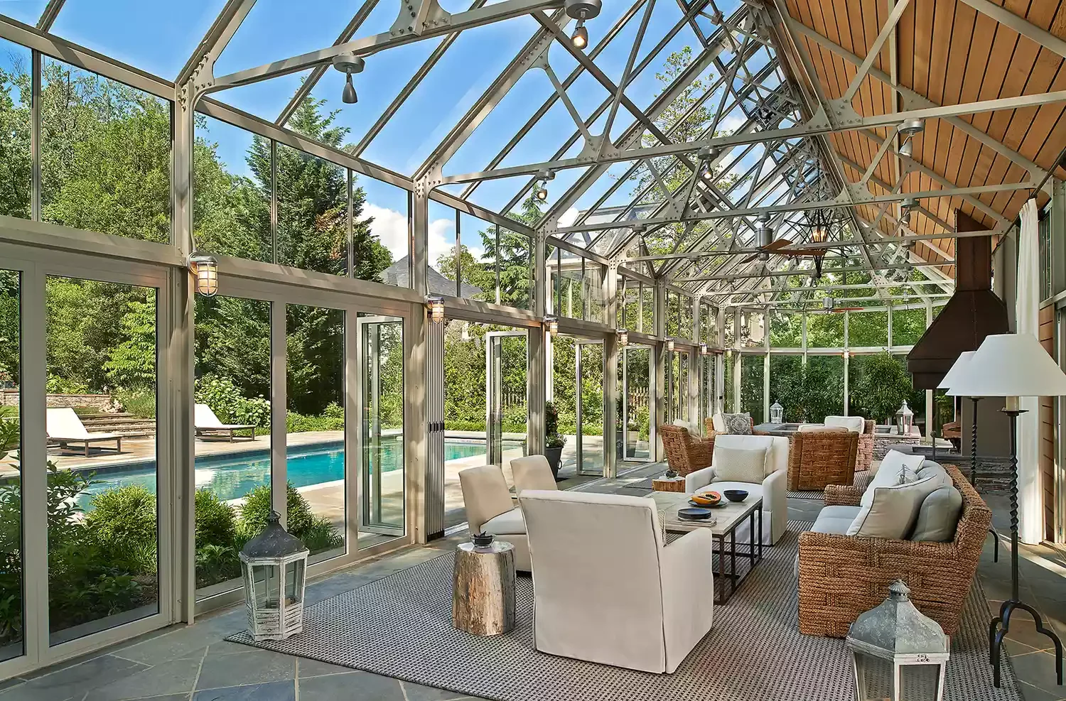29 Stunning Three-Season Porch Ideas That'll Make You Want to Live Outdoors 6 A Dramatic Poolside Lounge