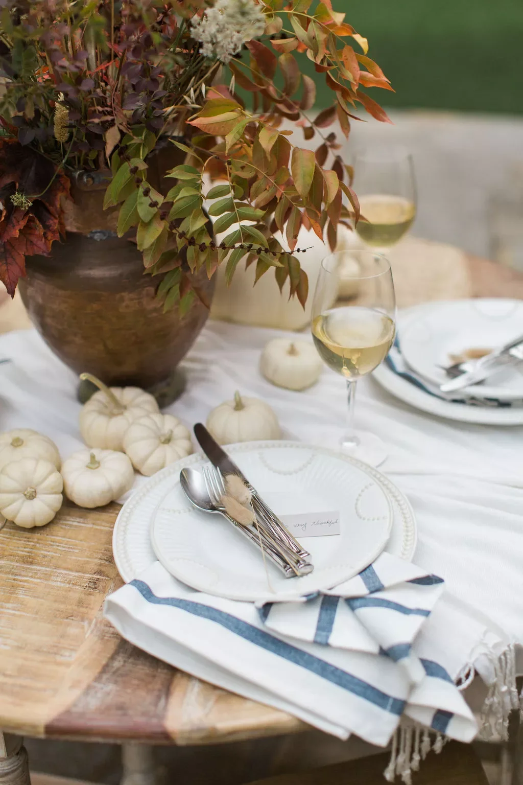 15 Thanksgiving Napkin Ideas That Wow Your Dinner Guests A Plate-Stacked Fold