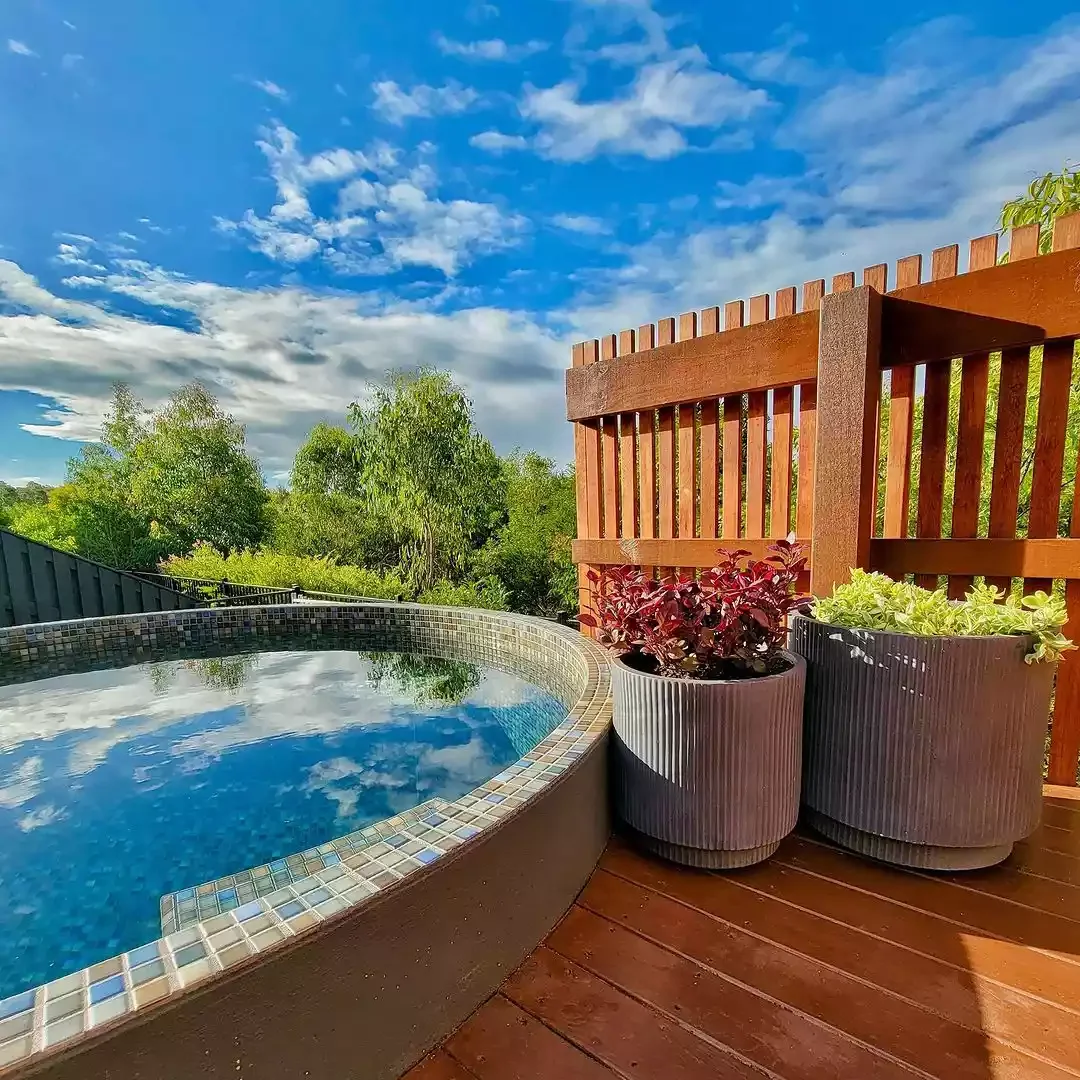 50 Semi-Inground Pool Designs That Transform Any Backyard Into Your Personal Paradise A Pool That's One With Nature