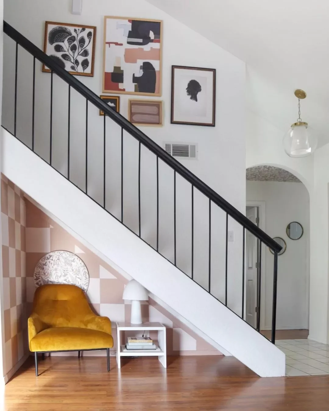 29 Stunning Staircase Design Ideas to Transform Your Home's Interior 19 A Quiet and Stylish Reading Nook
