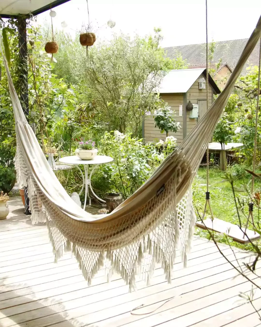29 Stunning Backyard Hammock Ideas to Create Your Perfect Relaxation Retreat 25 A Veranda Playground