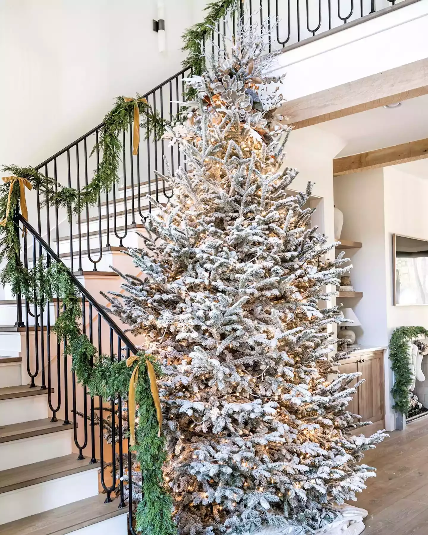 32 Stunning White Christmas Tree Ideas That Will Transform Your Holiday Decor 1 Accentuate the Stairs