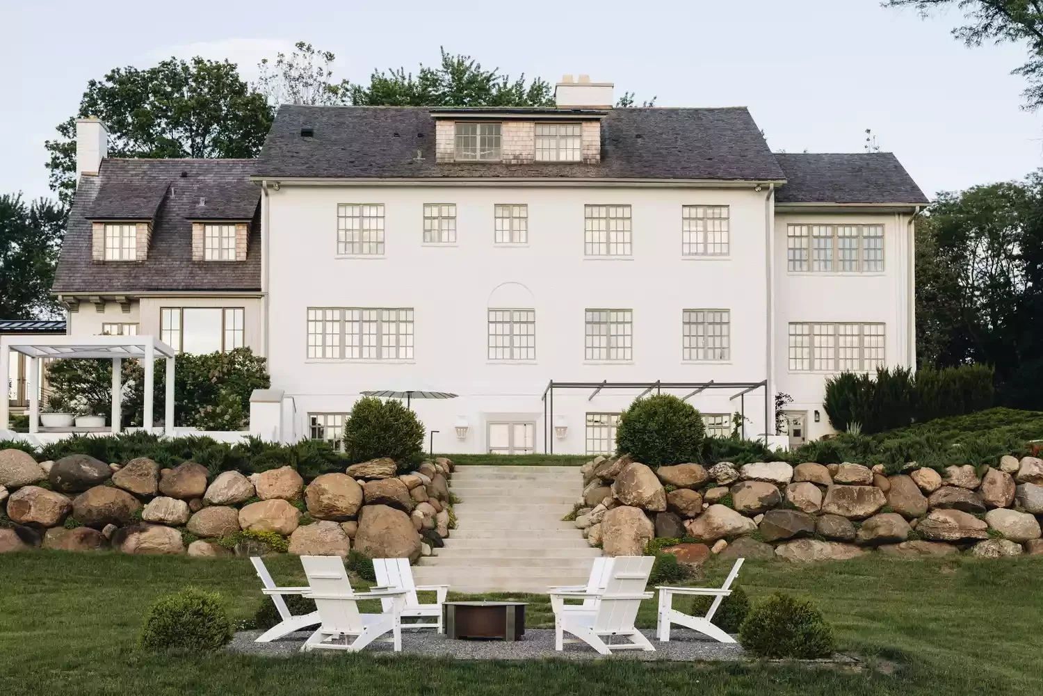 15 Creative Sloped Backyard Transformations That Maximize Your Outdoor Space Add Boulders for a Dramatic Effect