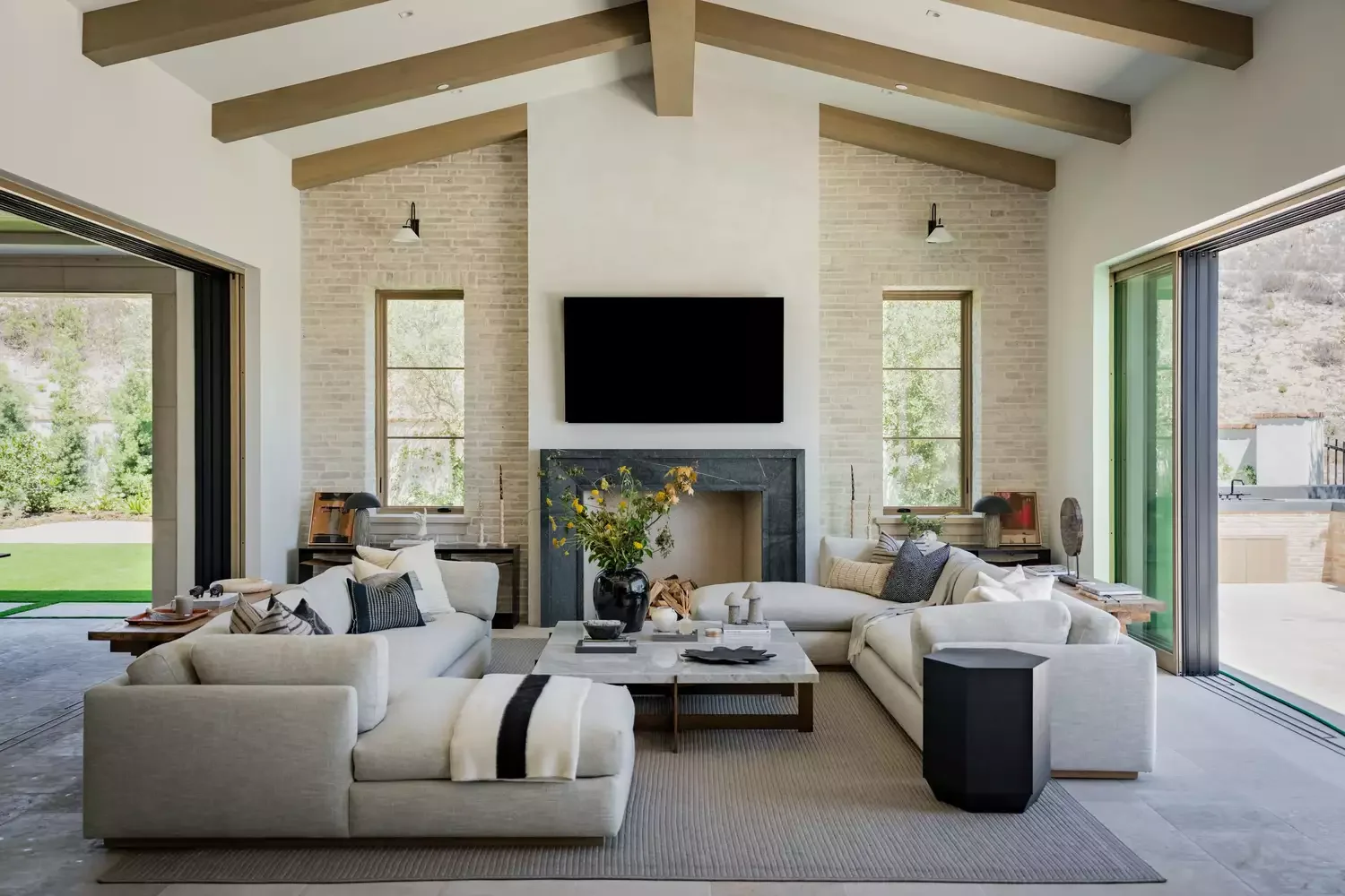 50 Contemporary Fireplace Designs That Will Transform Your Living Space 8 Add Contrast with Dark Stone