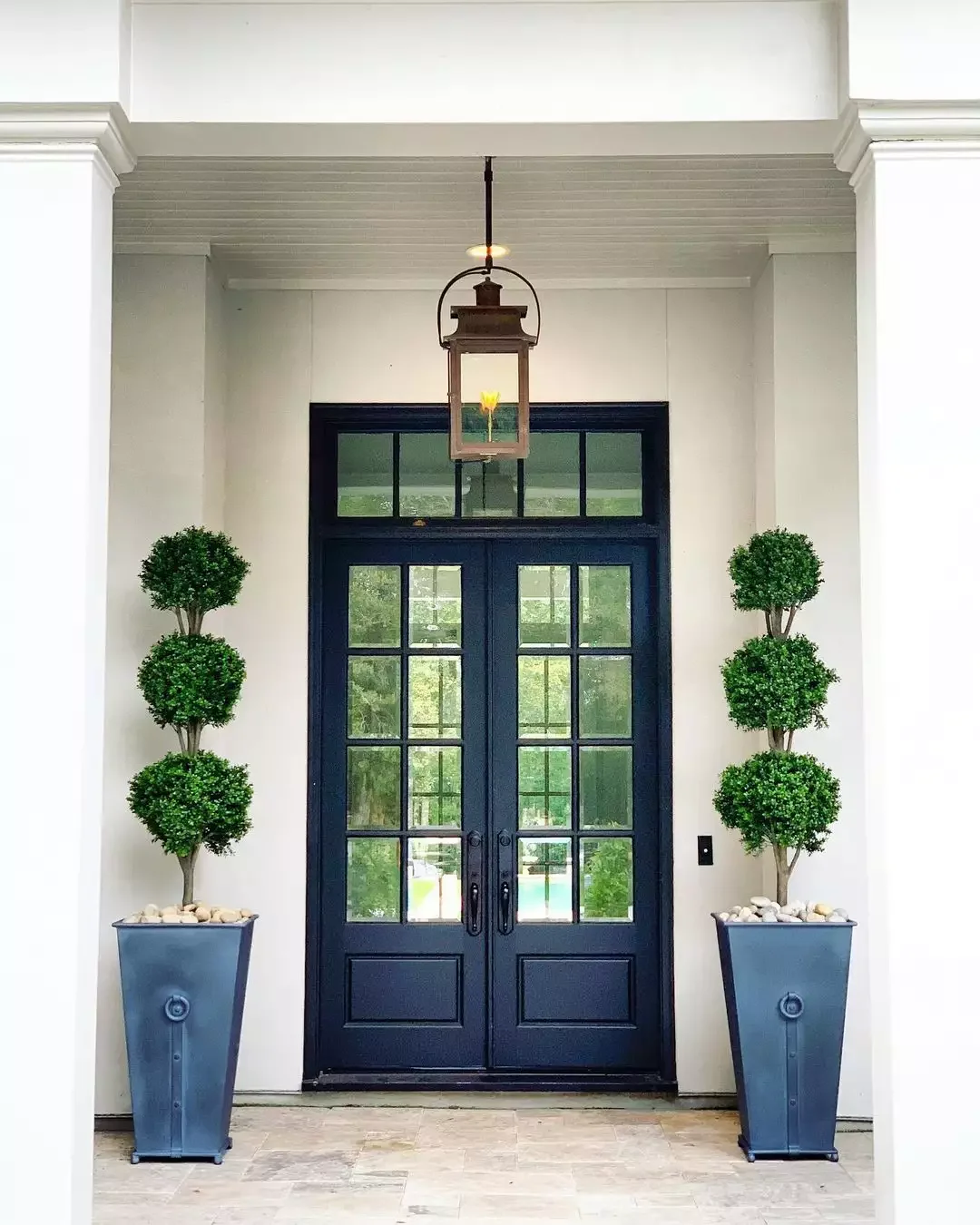 33 Stunning Black Front Door Ideas That Transform Your Home's Entrance Add Elegance with Topiaries