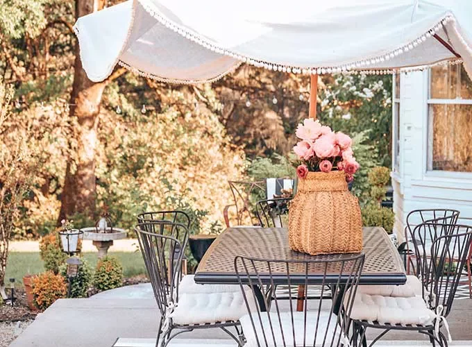 40 Budget-Friendly DIY Backyard Projects to Create Your Dream Outdoor Space Add Flair to Your Patio Umbrella Using Pom Poms