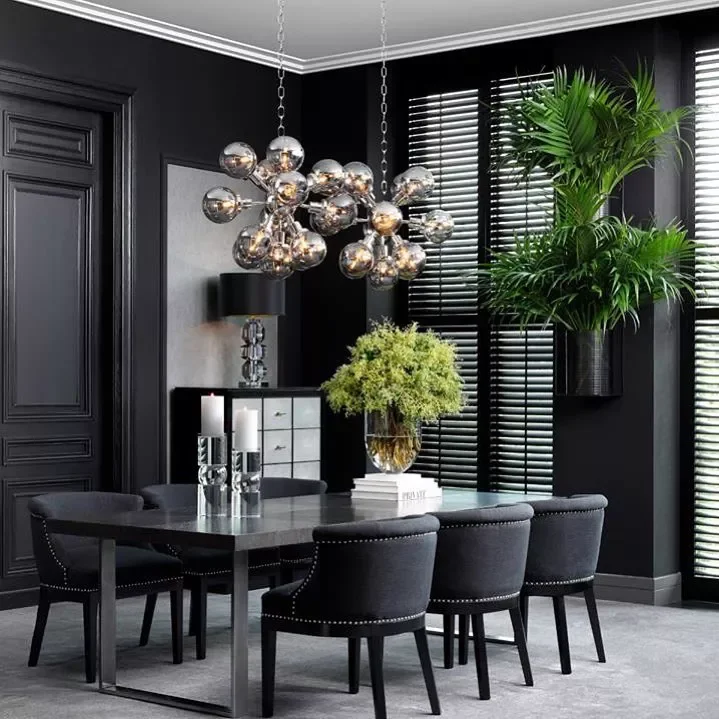 40 Stunning Black Dining Room Ideas to Transform Your Space 16 Add Plants for Contrast