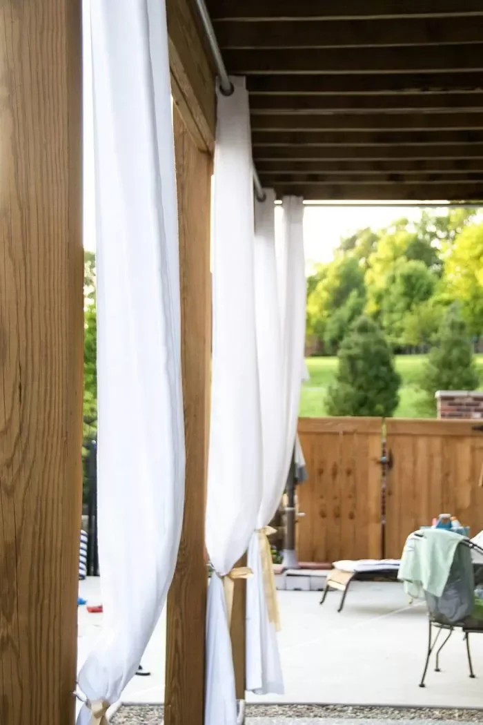 36 Simple Patio DIY Projects to Transform Your Outdoor Space 33 Add Privacy Curtains