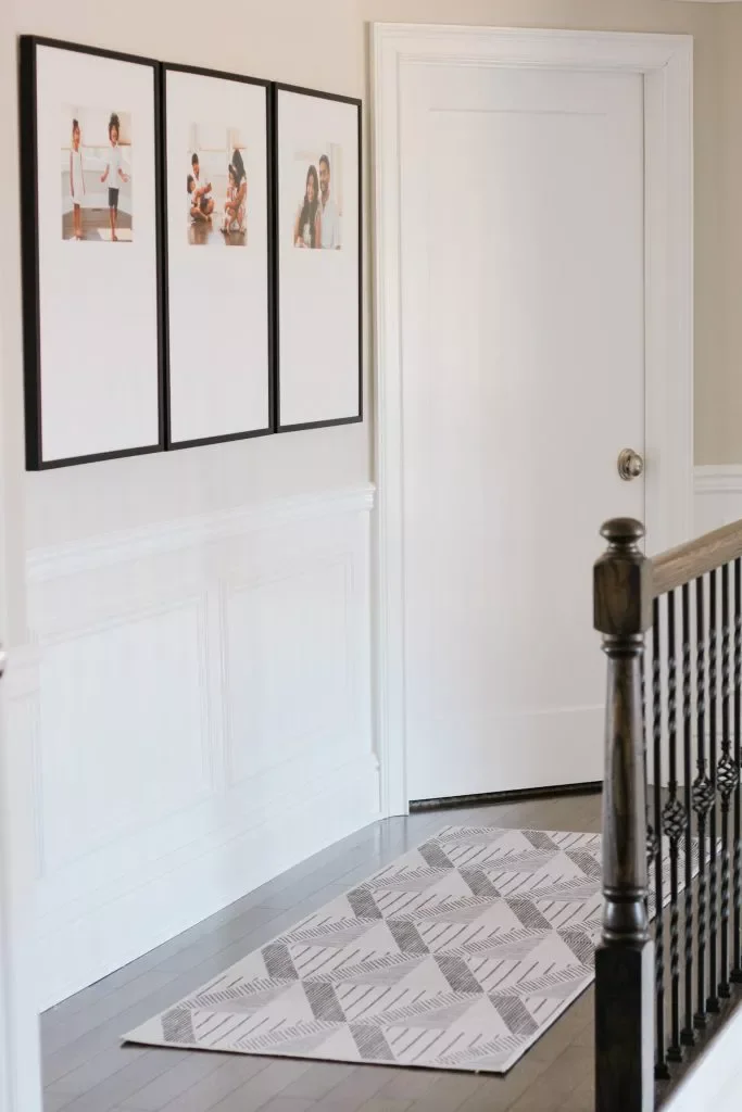 26 Creative Family Photo Wall Ideas That Will Transform Your Home 2 Add Small Photos to Large Frames