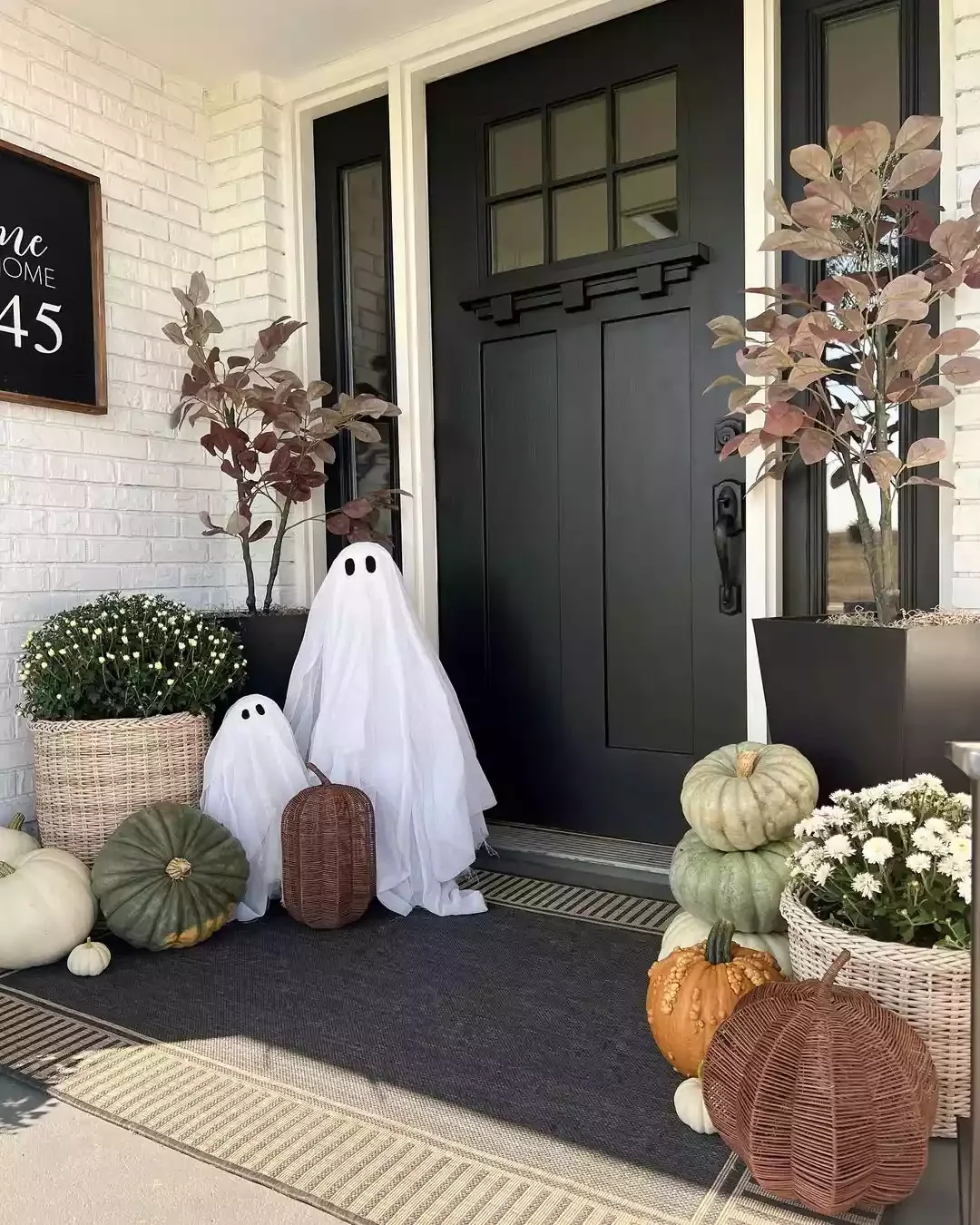 33 Spooktacular Halloween Front Porch Ideas That'll Make Your Home the Neighborhood's Must-See Destination 13 Add Some Friendly Ghost Greeters