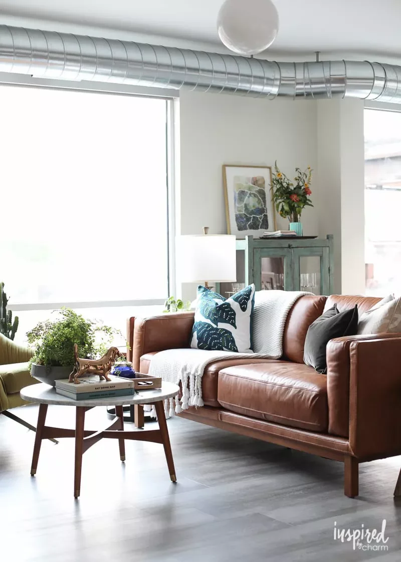 19 Affordable Ways to Transform Your Apartment Living Room 17 Add Vintage Accents