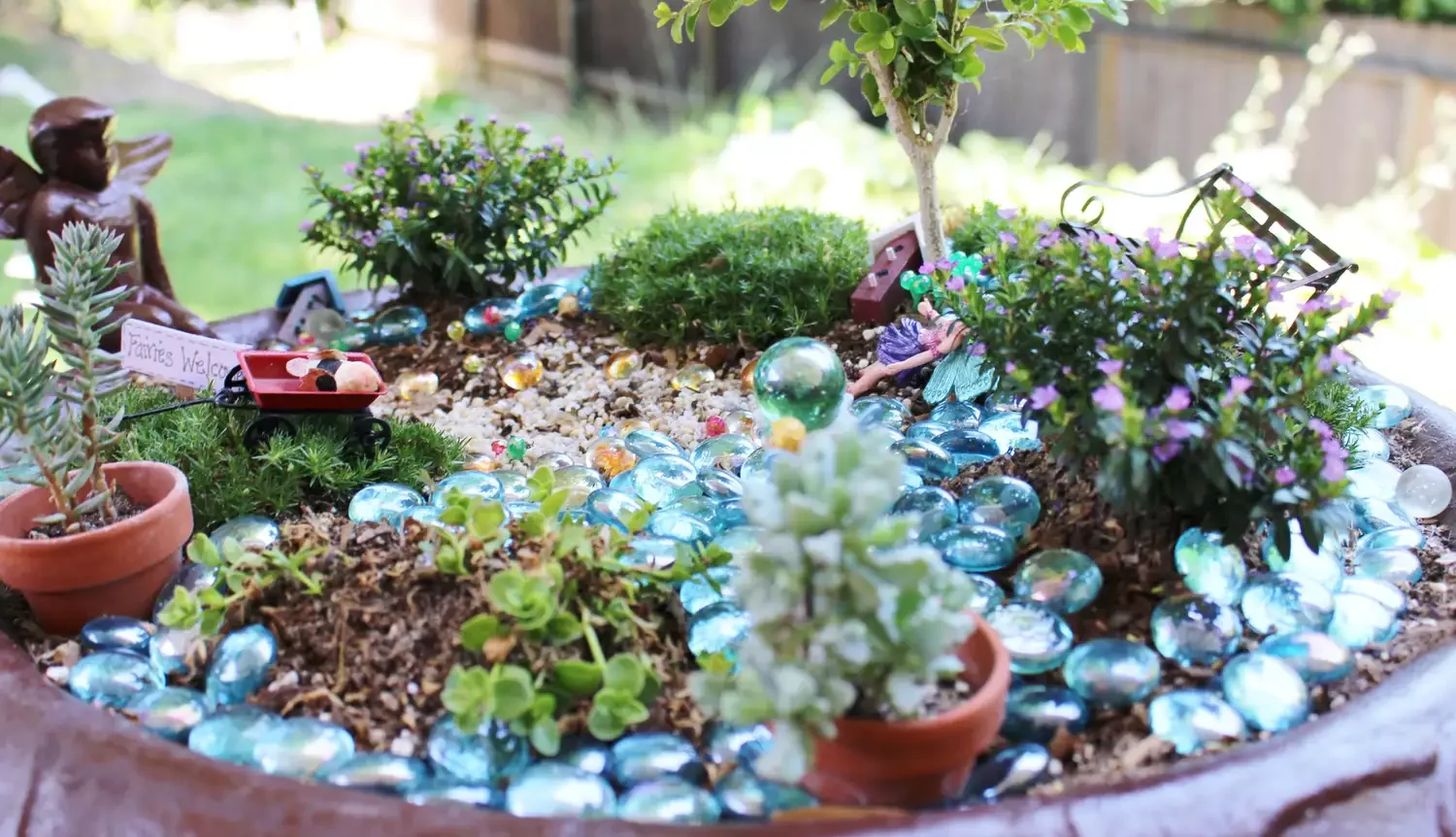 43 Budget-Friendly Backyard Makeover Ideas That Look Expensive 7 Add a Bird Bath Fairy Garden