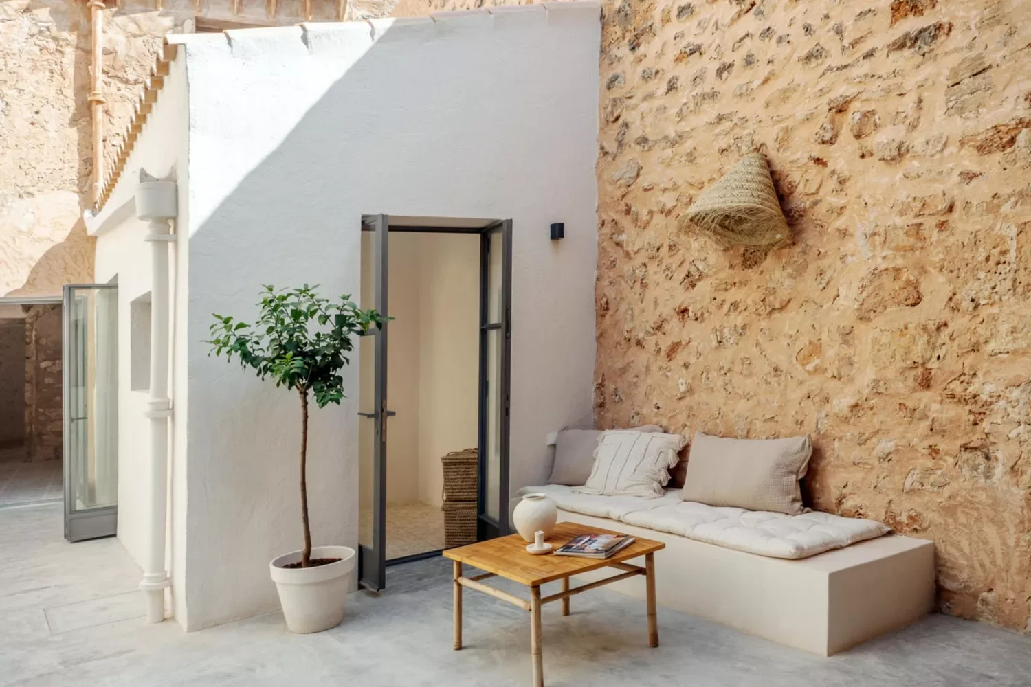 30 Budget-Friendly Ways to Transform Your Concrete Patio 10 Add a Daybed