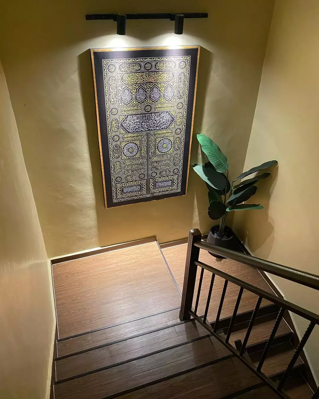 24 Creative Staircase Landing Decorating Ideas to Transform Your Space 11 Add a Faux Plant