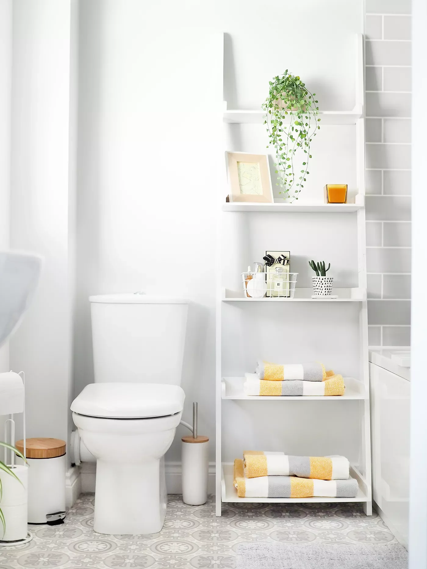 43 Smart Bathroom Storage Solutions That Maximize Every Inch Add a Leaning Bookshelf