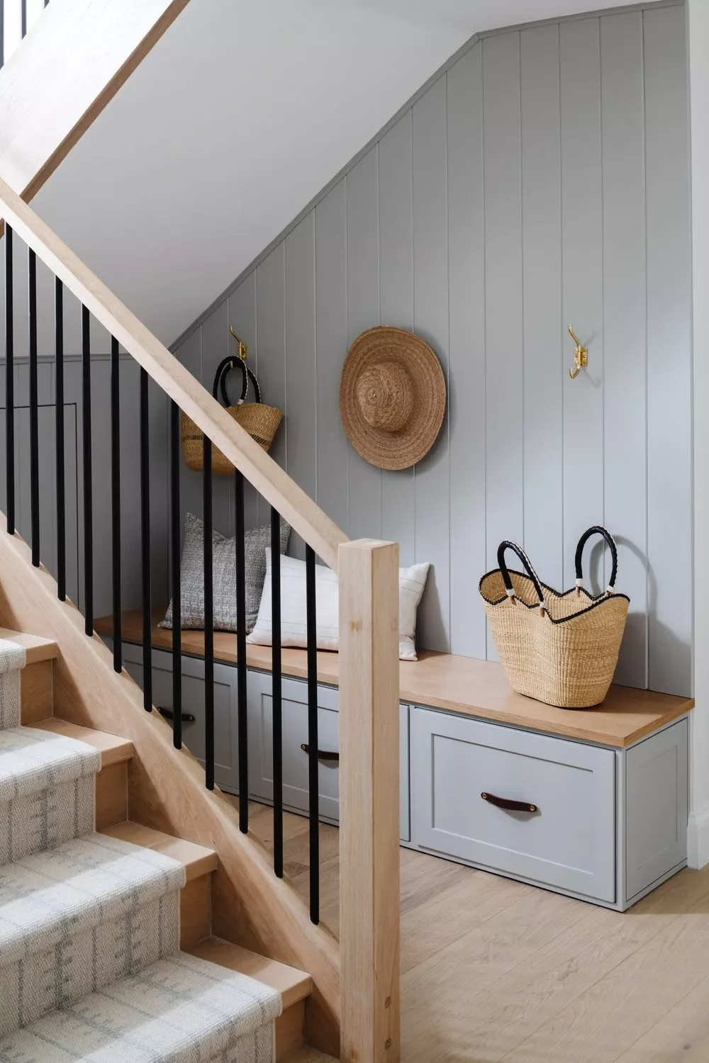 32 Staircase Design Ideas That Transformed Homes This Year Add a Mudroom Under the Stairs