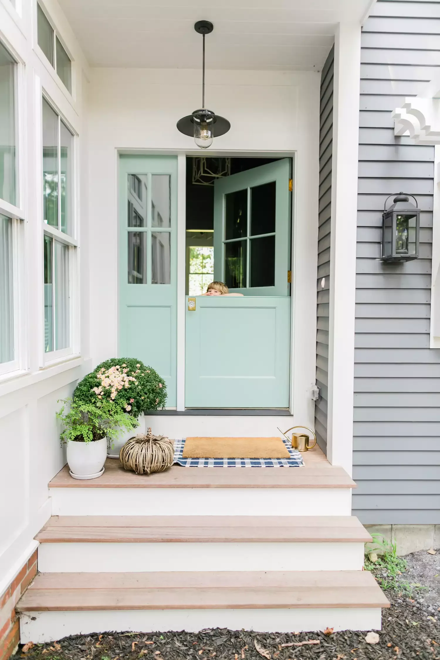 38 Charming Farmhouse Porch Ideas That Create the Perfect Welcome 20 Add a Pop of Color
