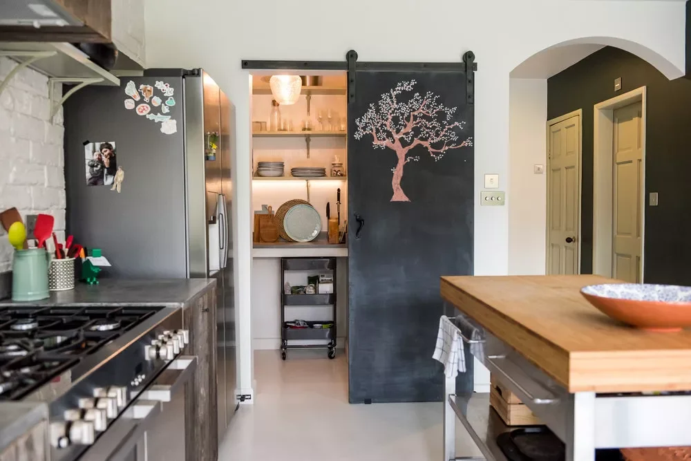 37 Brilliant Pantry Storage Solutions That Make Organization Look Effortless Add a Sliding Barn Door