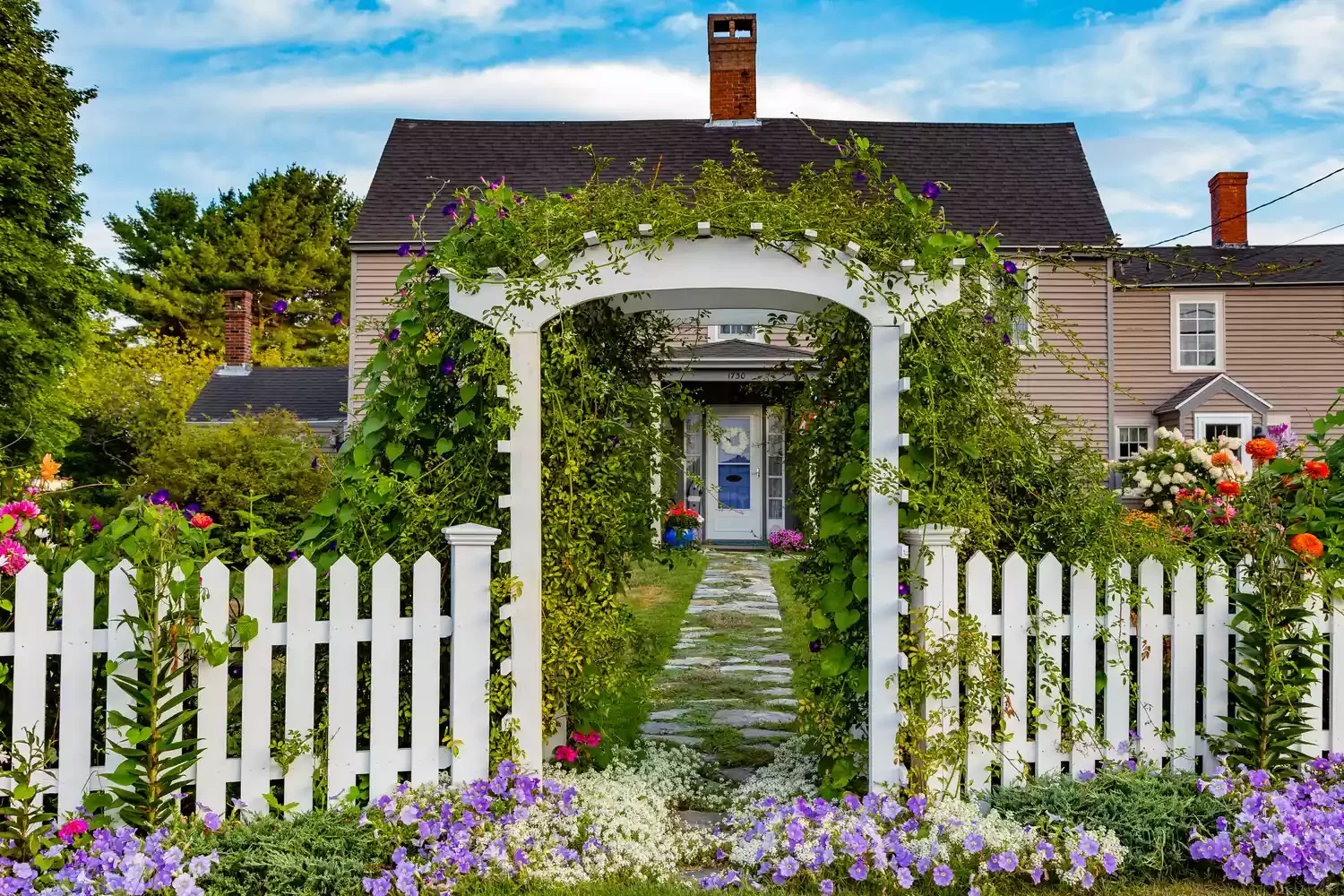 14 Affordable Picket Fence Ideas to Create Classic Charm and Enhanced Privacy in Your Outdoor Space Add a Trellis