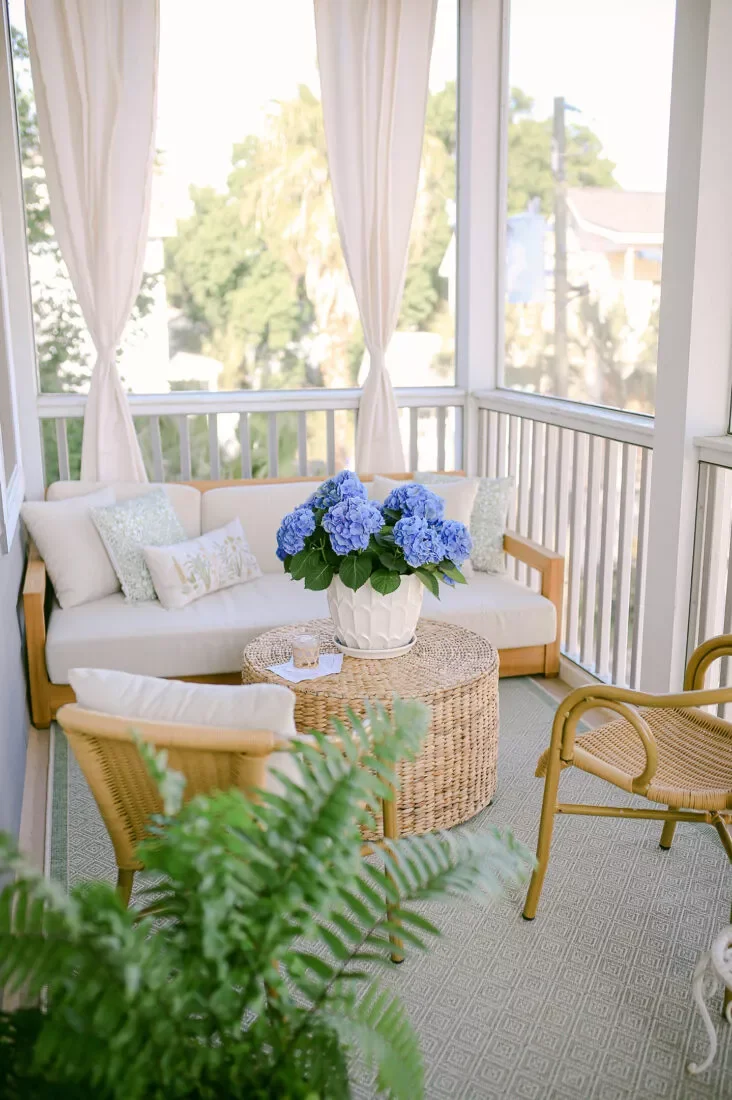62 Stunning Screen Porch Ideas to Create the Perfect Indoor-Outdoor Retreat Add a Vase of Porch Flowers