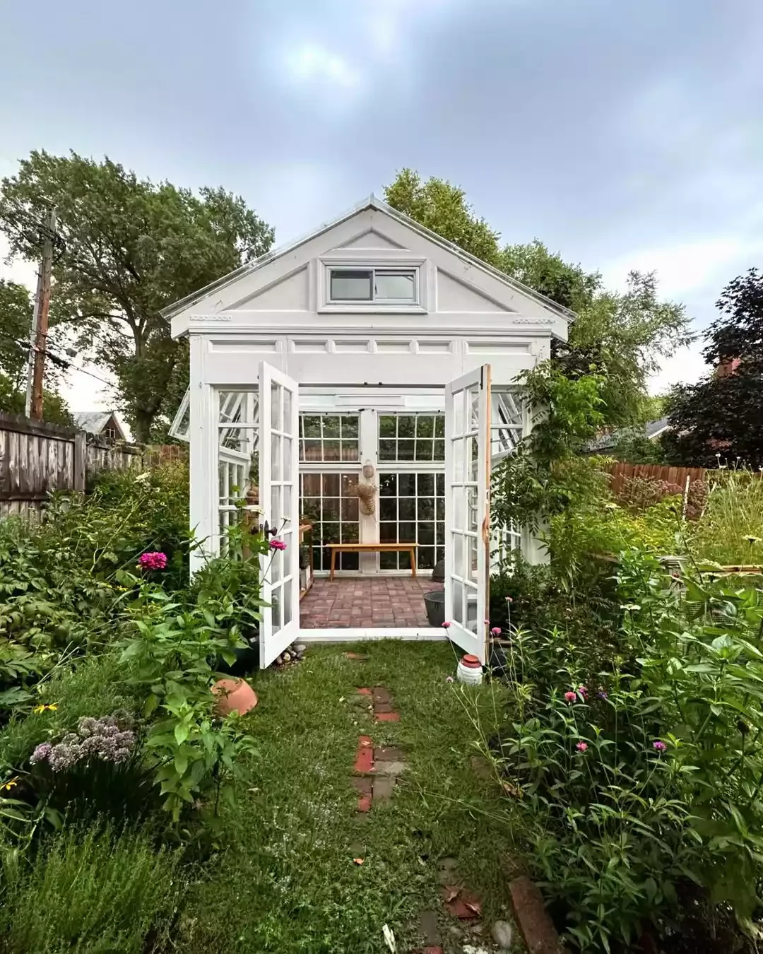 35 Enchanting Cottage Garden Ideas That Transform Your Outdoor Space Into a Magical Retreat Add an Elegant White Greenhouse