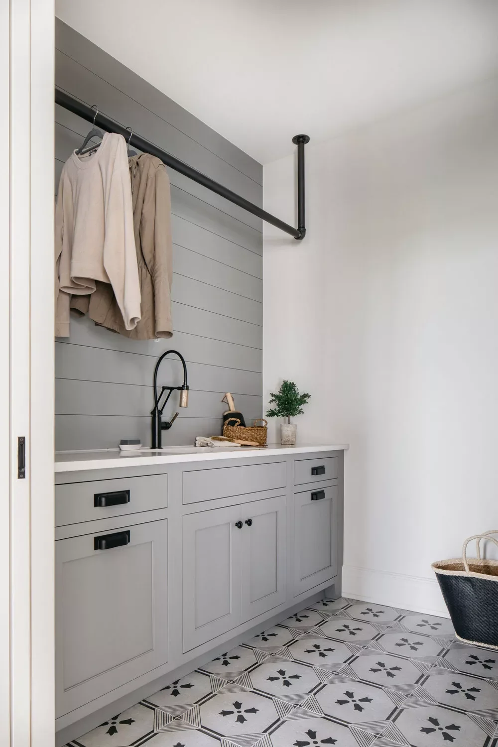 57 Creative Laundry Room Ideas That'll Make You Actually Enjoy Doing Chores Add an Industrial Pipe Rack