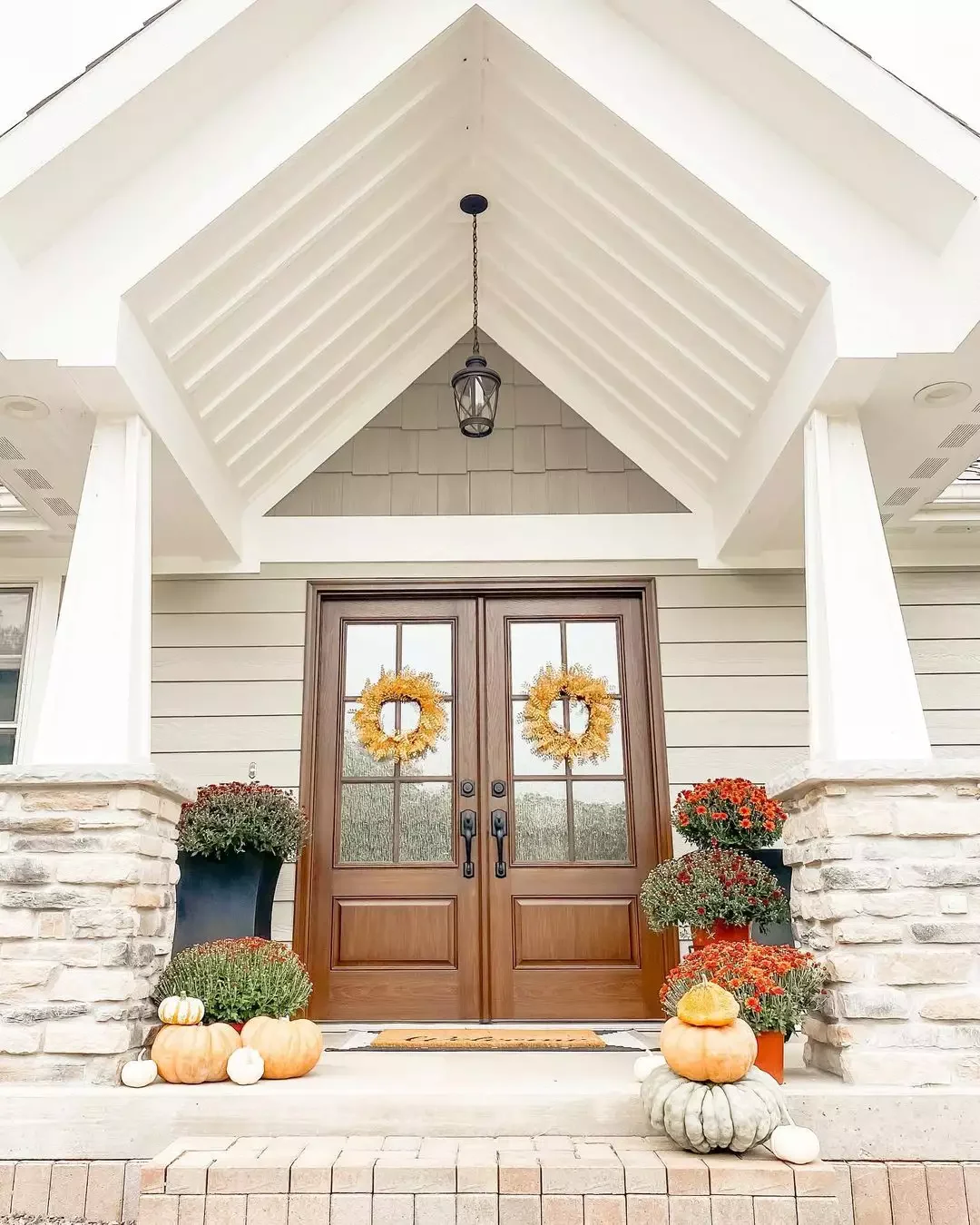 52 Autumn Front Porch Ideas That Will Transform Your Home's Entrance This Fall 46 Aim for Balance, Not Symmetry