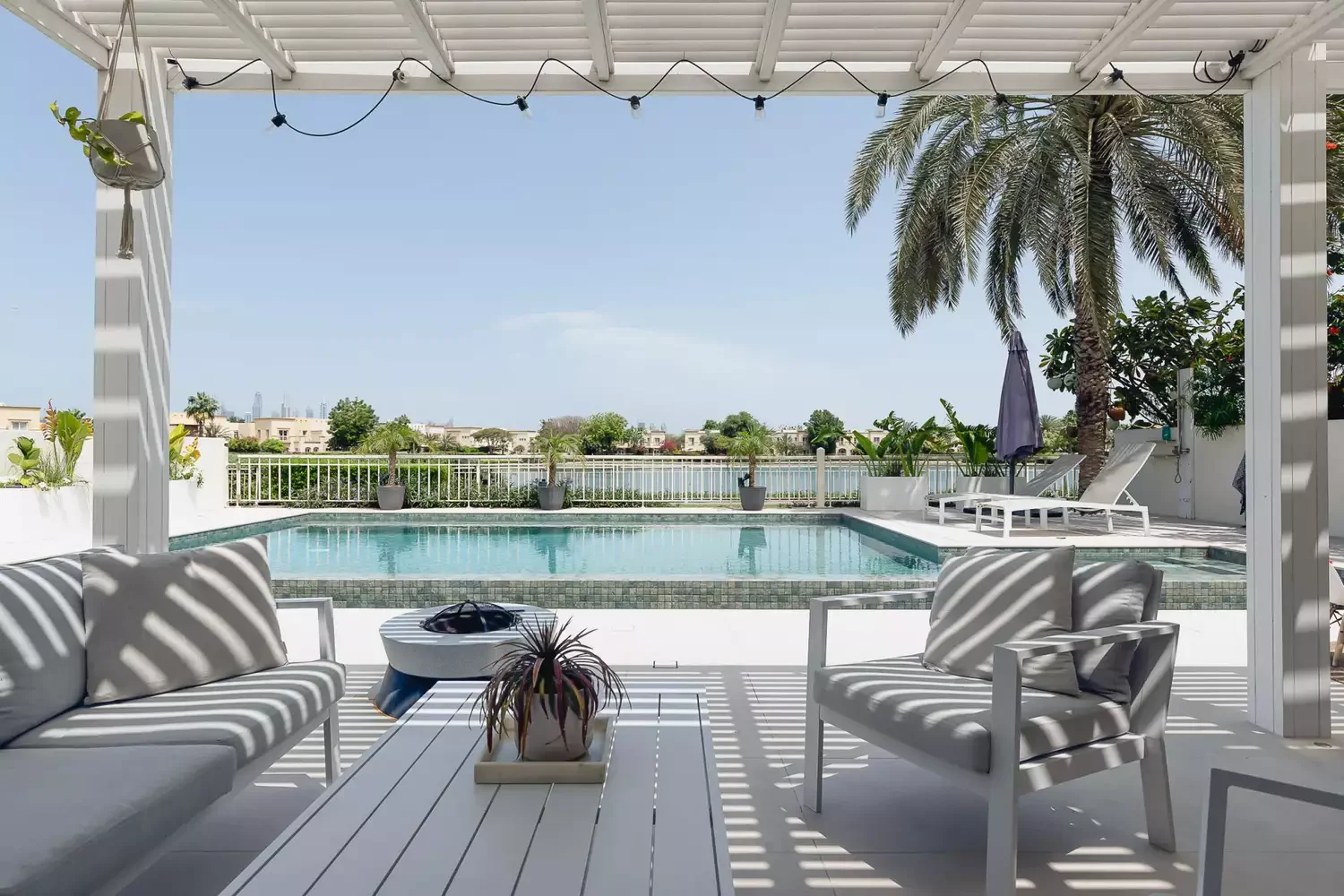 20 Stunning Modern Pergola Designs That'll Transform Your Outdoor Living Space 2 All-White Painted Wood Pergola