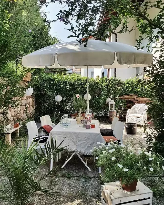 20 Budget-Friendly Backyard Designs That Ditch the Grass (and All That Maintenance) 17 An Outdoor Dining Room