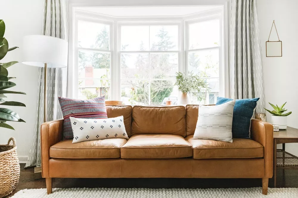 45 Brilliant Bay Window Ideas That Will Transform Your Home 24 Anchor the Couch
