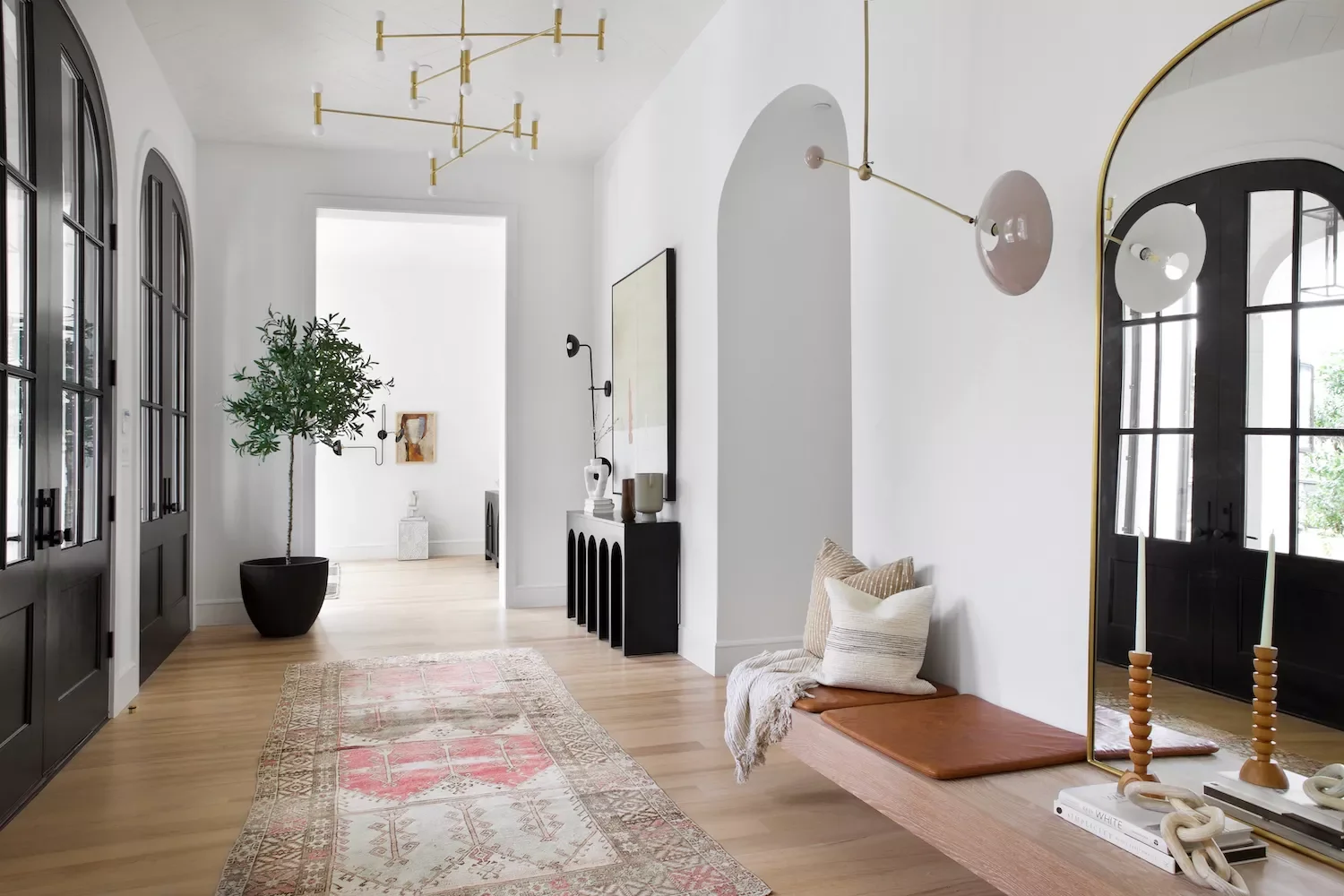 35 Stunning Black Door and White Trim Combinations That Create Perfect High-Contrast Drama 21 Arched White Door Trim