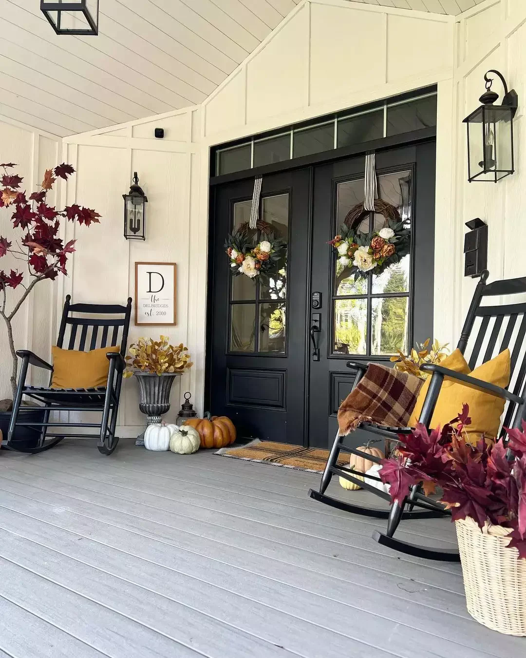 52 Autumn Front Porch Ideas That Will Transform Your Home's Entrance This Fall 44 Arrange Fall Flowers in an Urn Planter