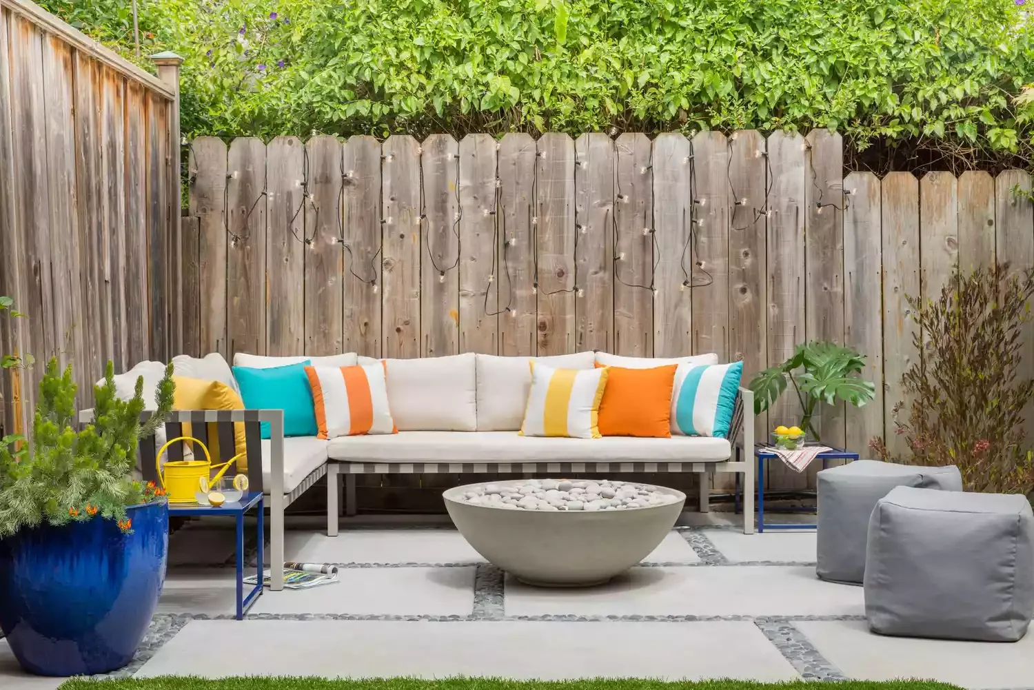 20 Stunning Grass-Free Backyard Designs That Create Lush Outdoor Retreats 16 Arrange Some Poufs