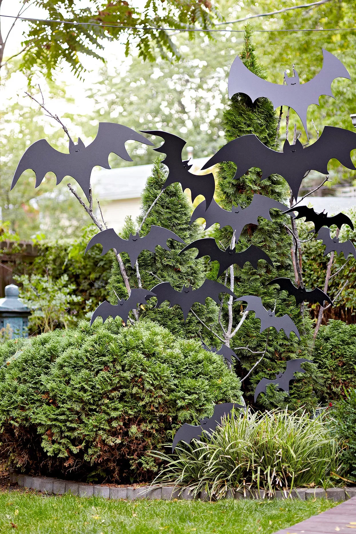 56 Creative DIY Halloween Decorations for Outdoor Spaces 22 Bats in the Bushes