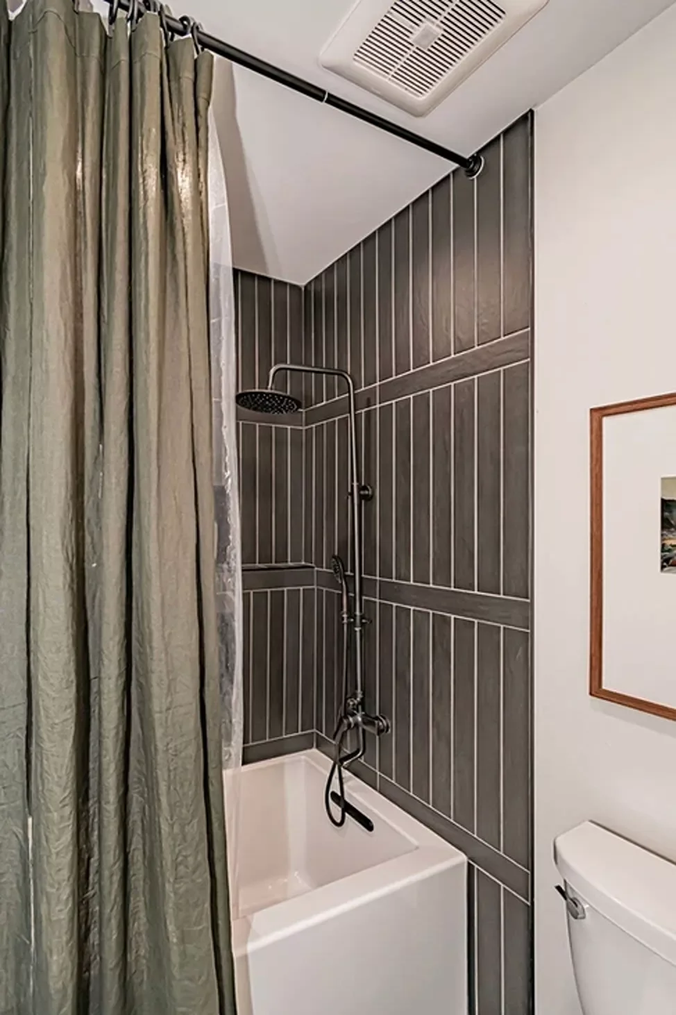 30 Stunning Corner Shower Designs to Elevate Your Bathroom 6 Black Tiled Corner Shower