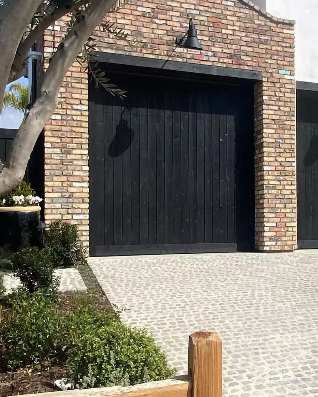 52 Stunning Garage Door Ideas That Will Transform Your Home's Curb Appeal Black Wood Vertical Panels