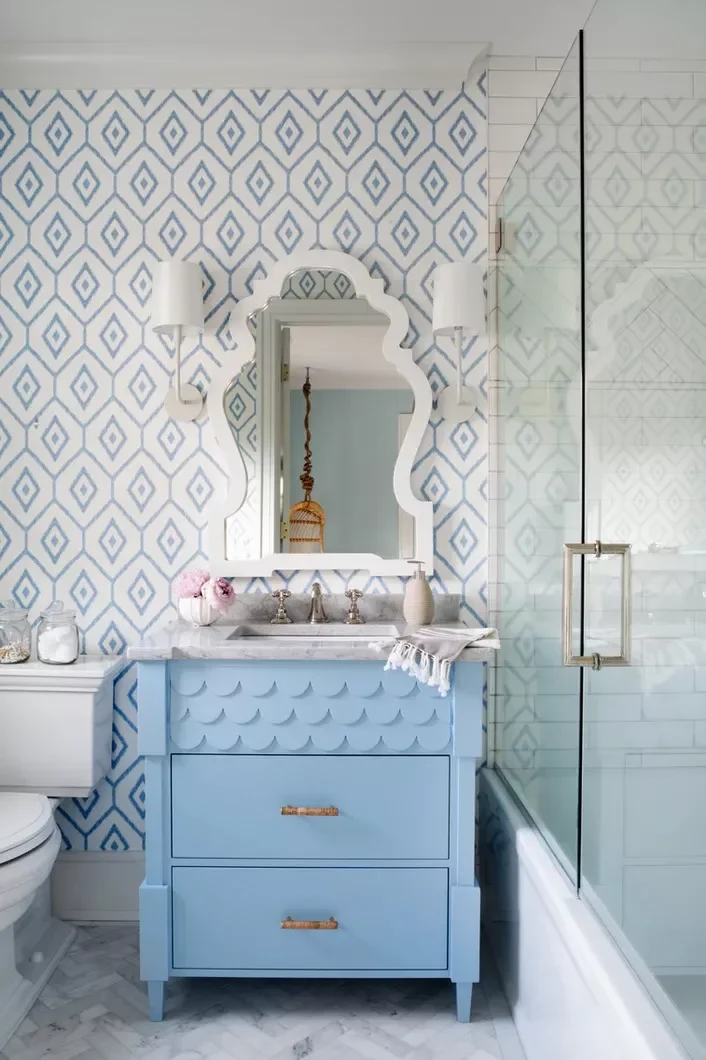 25 Compact Bathroom Vanity Ideas That Maximize Style and Storage 18 Blue Vanity With Scalloped Details