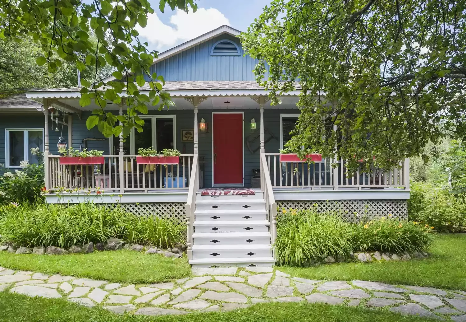 30 Stunning Porch Railing Designs to Transform Your Outdoor Space 12 Bold Red Flower Boxes
