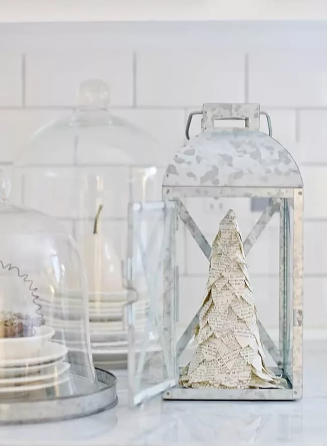 25 Stunning Christmas Lantern Ideas That'll Make Your Holiday Decor Absolutely Magical 11 Book Page Tree