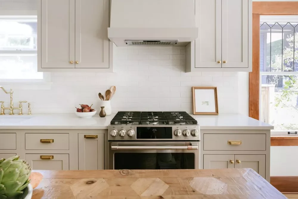 36 Stunning Kitchen Cabinet Hardware Ideas That Transform Your Space Brass and Bronze with Taupe