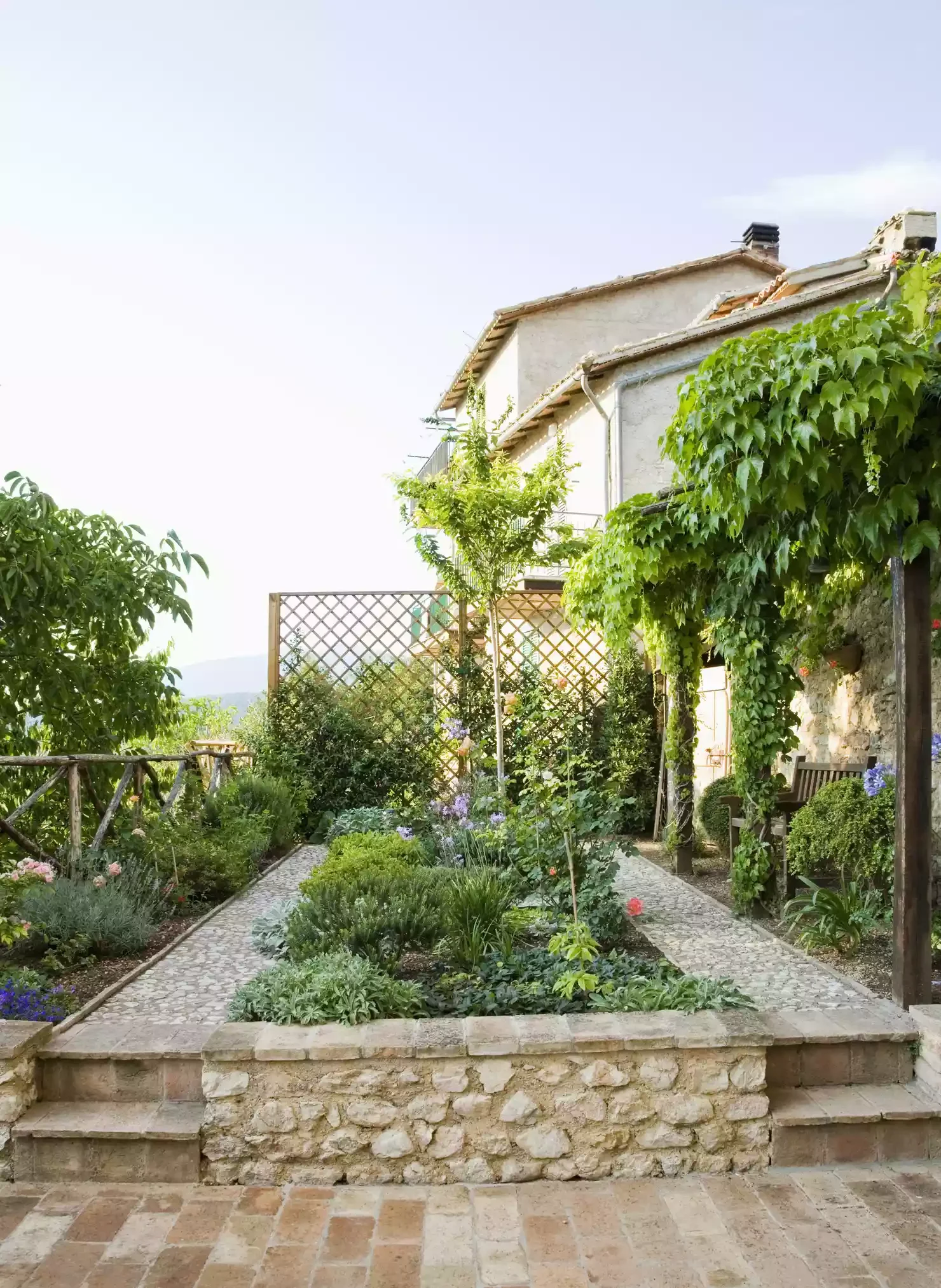 35 Stunning Brick Patio Ideas That Transform Outdoor Spaces Brick Patio With Raised Garden