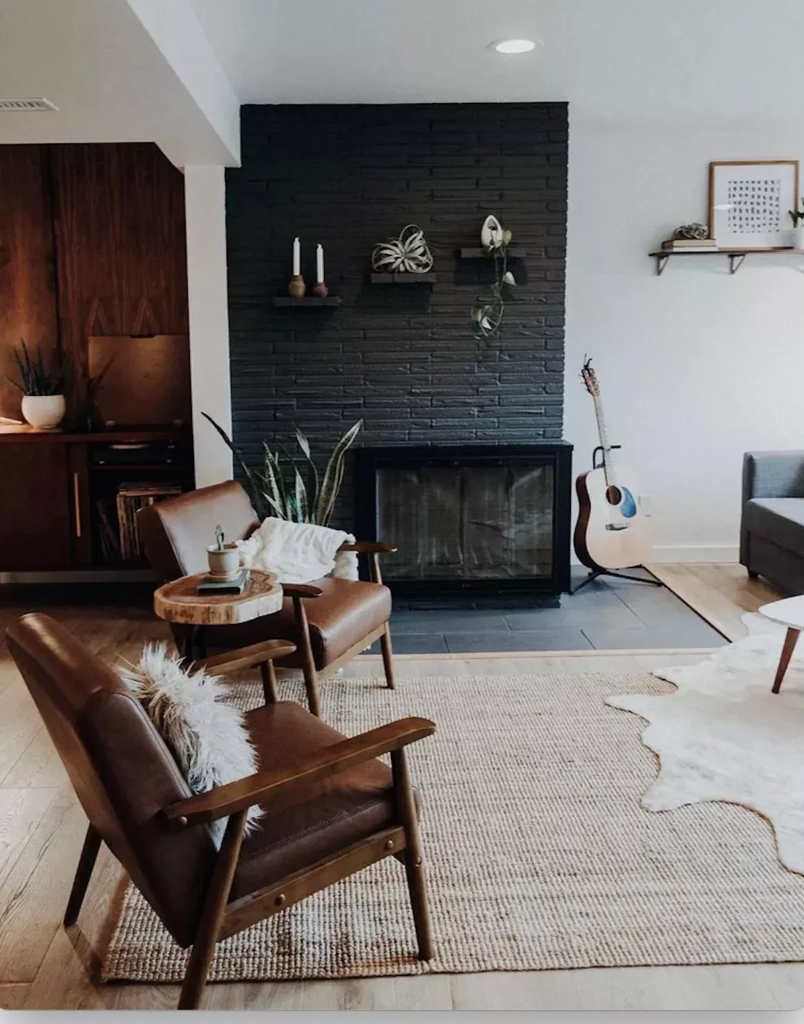 35 Bold Black Fireplace Designs That Transform Any Room Into a Stunning Showcase 33 Brick, Tile, and Metal