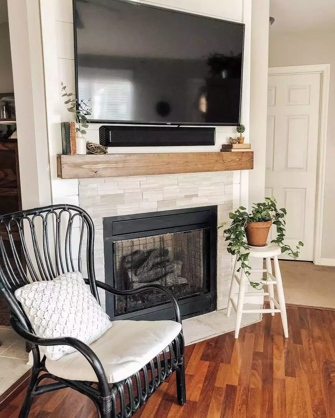 25 Stunning Corner Fireplace Ideas That'll Transform Your Living Space 24 Bring Out a Simple Stool