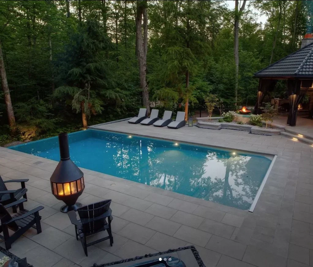 14 Stunning Pool Lighting Ideas That Will Transform Your Backyard Oasis 6 Bring in a Fire Pit