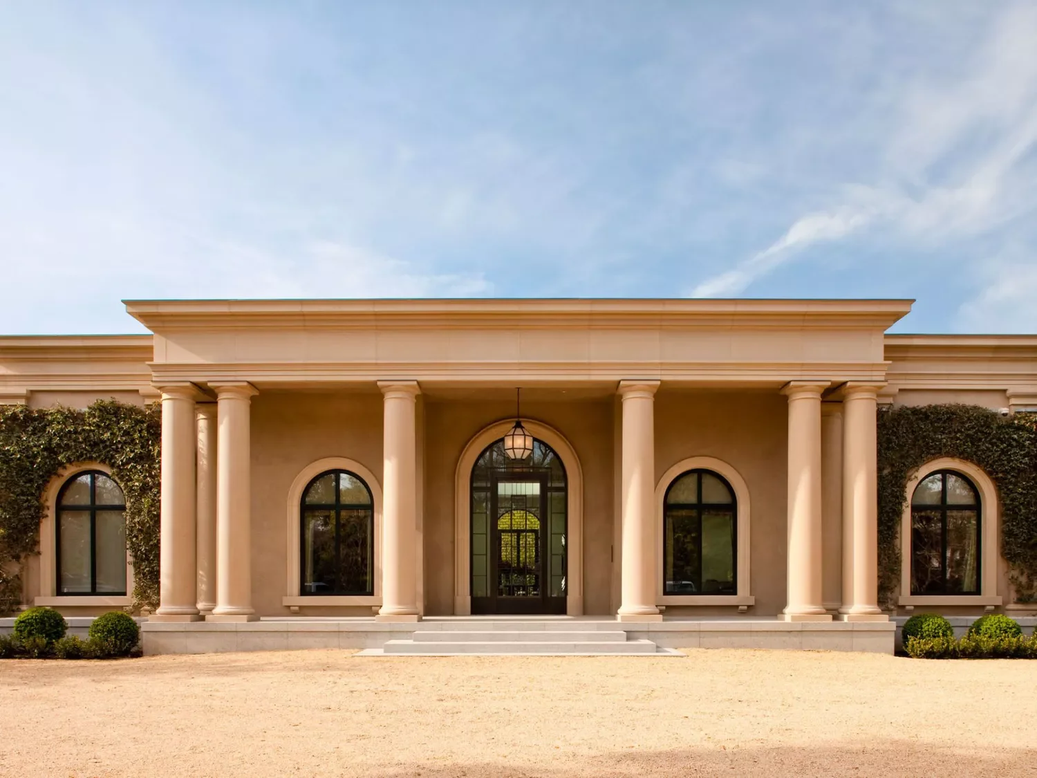 20 Stunning Front Porch Column Designs to Transform Your Home's Curb Appeal 13 Bring the Drama With a Colonnade