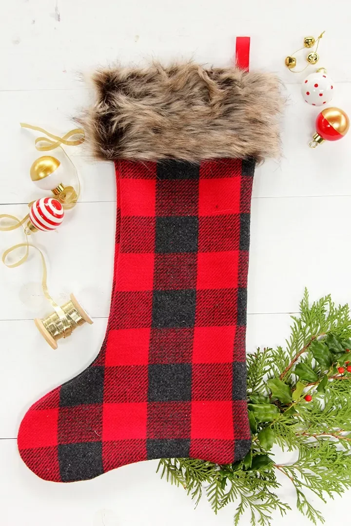 41 Creative DIY Christmas Stocking Ideas That Will Transform Your Holiday Decor 27 Buffalo Plaid and Faux Fur Trim Stocking