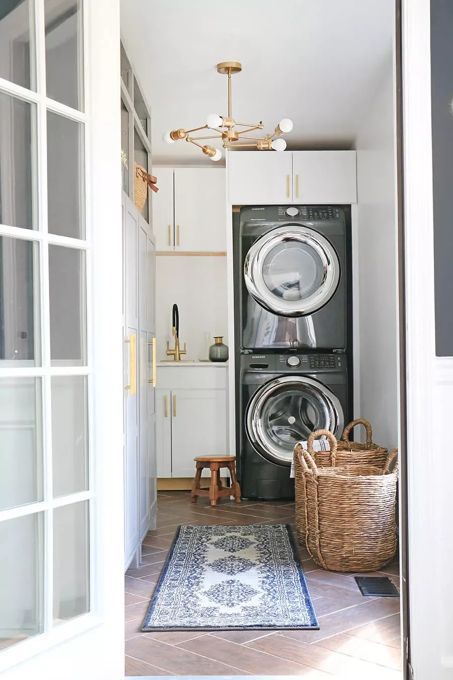 42 Brilliant Laundry Room Organization Solutions to Try This Season Cabinets Above Stacking Appliances